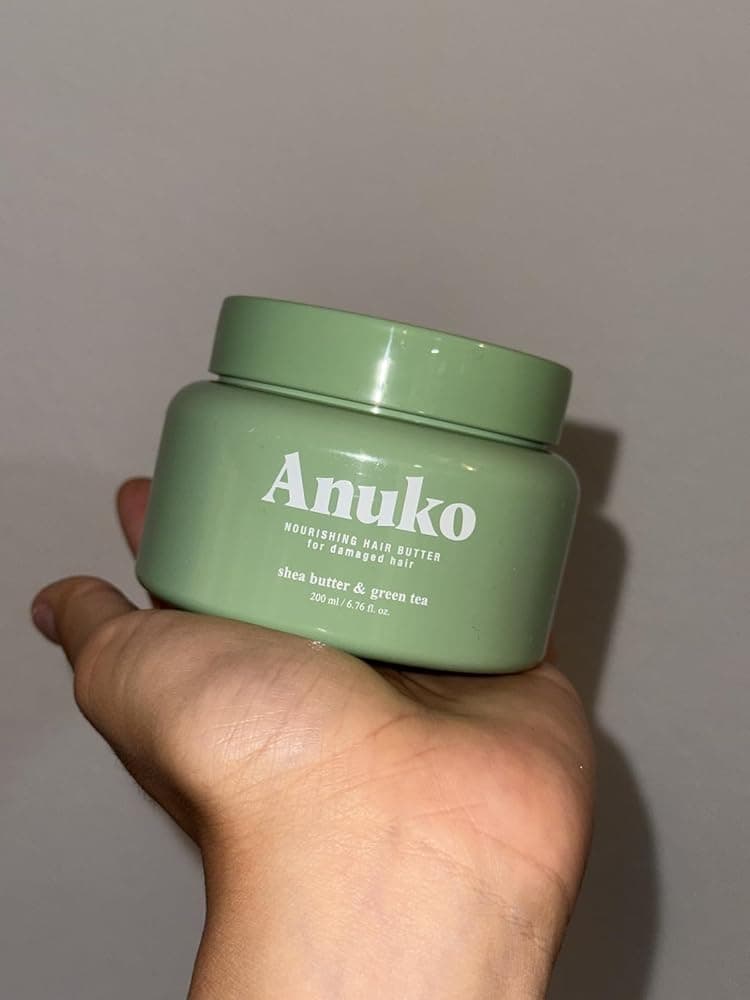 A verified Anuko customer showing their hair after using the Hair Butter
