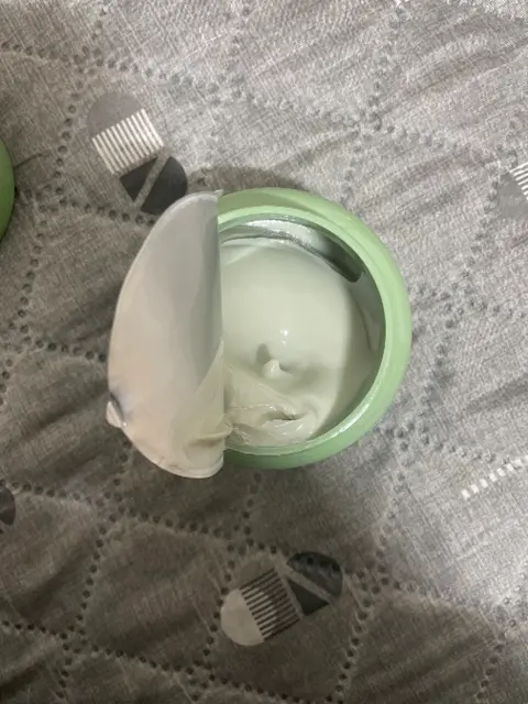 The customer's open jar of Anuko Nourishing Hair Butter with the cream visible
