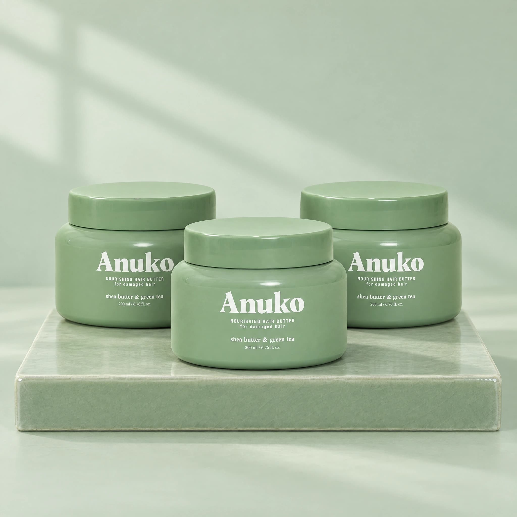 Three full-size Anuko Nourishing Hair Butter jars